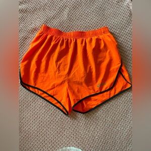 Orange and black running shorts with drawstring waist